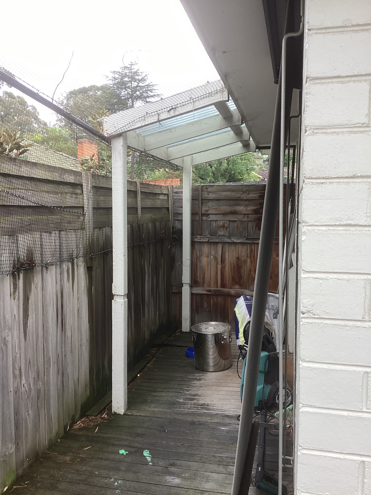 Before photo showing damaged deck prior to repair work