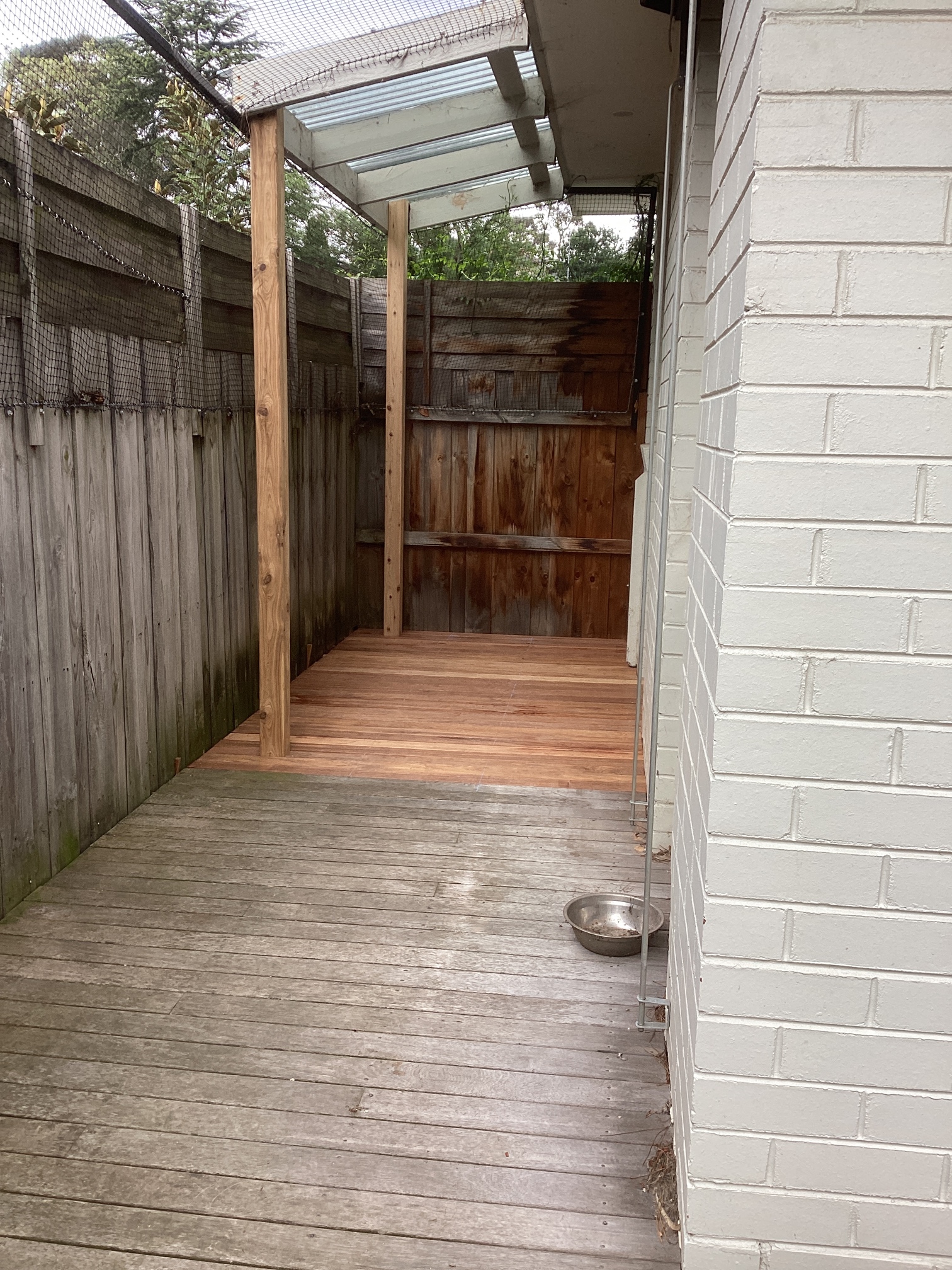 After photo of completed deck repair with restored timber boards